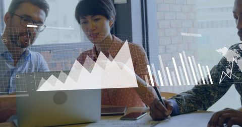 Diverse Team Analyzing Business Data and Graphs on Laptop