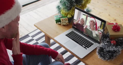 Man Celebrating Christmas Video Call with Friends