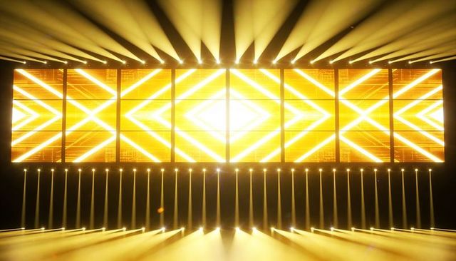 Golden multipanel led wall: chevron diamond patterns, moving head beams, vertical light tubes