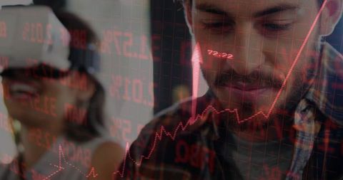 Young Professional Analyzing Stock Market Trends and Technology