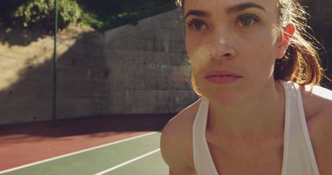Focused Athlete Preparing for Competitive Tennis Match