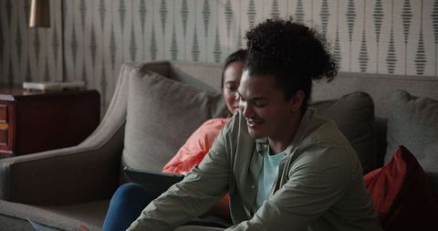 Joyful couple discussing wedding plans on cozy living room couch
