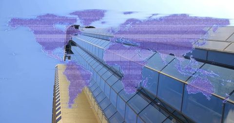 Soaring reflective skyscraper with purple digital world map overlay