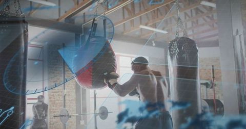 Shirtless boxer punching heavy bag in industrial gym with futuristic hud overlay