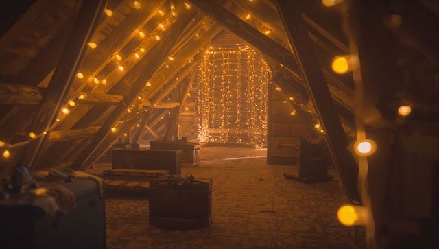 Rustic Attic with Warm Fairy Lights and Vintage Suitcases