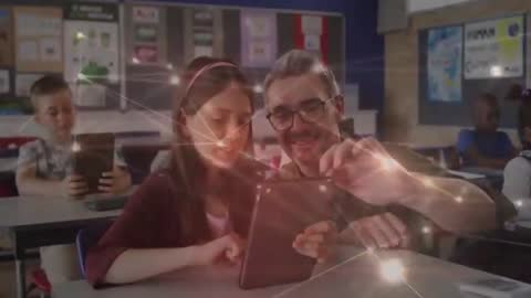 Teacher Assisting Student with Tablet in Interactive Classroom