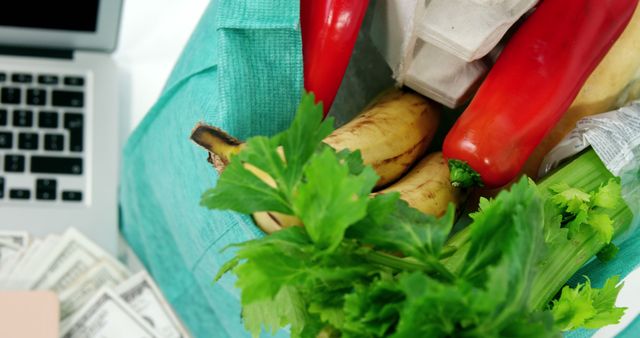 Fruits and Vegetables in Reusable Bag Next to Laptop and Money - Download Free Stock Images Pikwizard.com