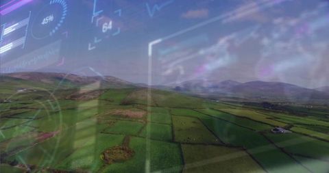 Aerial view of farmland with futuristic hud overlays