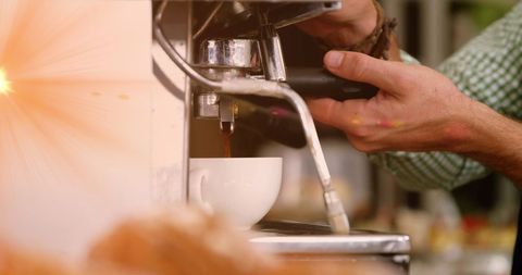 Barista Perfectly Calibrating Espresso Machine for Fresh Brew