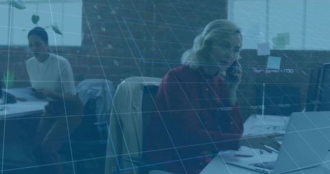 Woman in Open Plan Office Utilizing Technology for Productive Workday