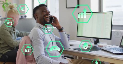 Ecology Icons Over Colleagues in Modern Office