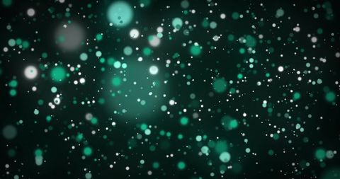 Hypnotic glowing green lights on dark background