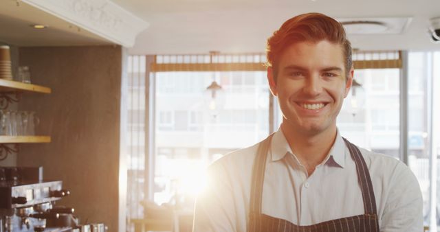 Smiling Barista in Coffee Shop with Sunlight in Background - Download Free Stock Images Pikwizard.com