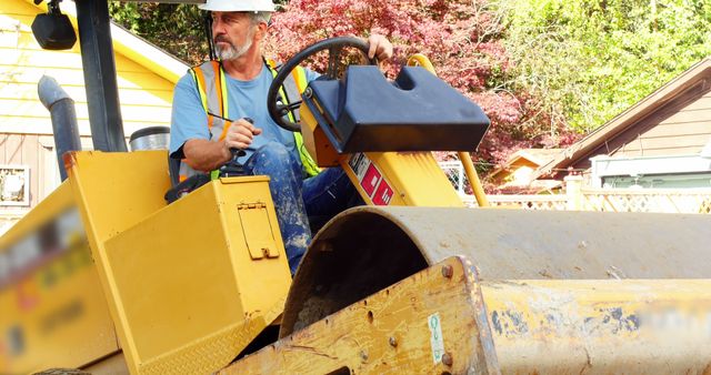 Construction Worker Operating Vibratory Roller Compactor at Job Site - Download Free Stock Images Pikwizard.com