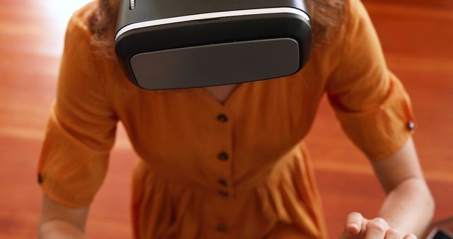 Woman Using Virtual Reality Headset in Orange Dress - Download Free Stock Images Pikwizard.com