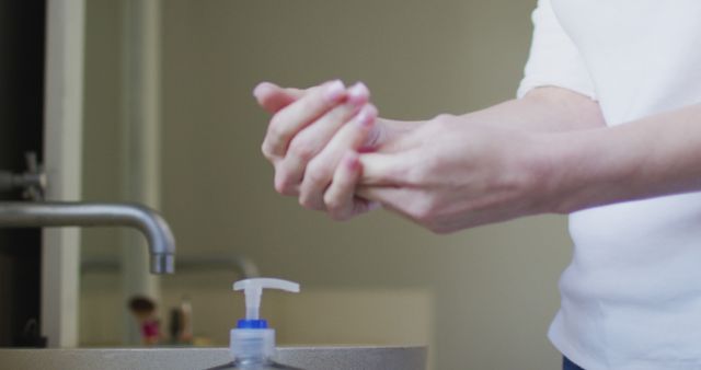 Person Washing Hands with Soap In Clean Bathroom - Download Free Stock Images Pikwizard.com