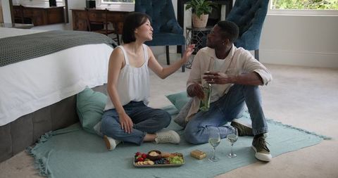 Couple Toasting with Wine Amidst Relaxation and Togetherness