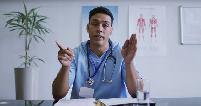 Confident Male Doctor Giving Health Advice in Office - Download Free Stock Images Pikwizard.com