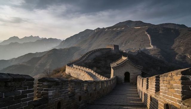 Great wall of china winding along misty mountain ridgeline with ancient watchtowers