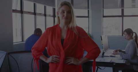 Confident female professional leading work in modern office