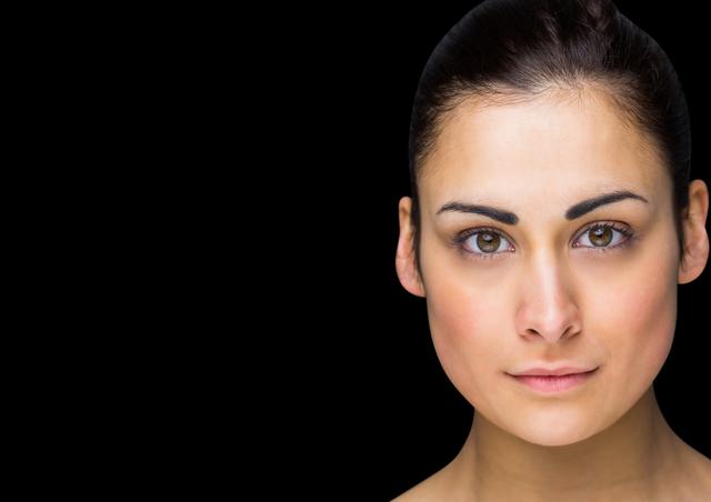 Close-up Portrait of Woman with Neutral Expression on Black Background - Download Free Stock Images Pikwizard.com