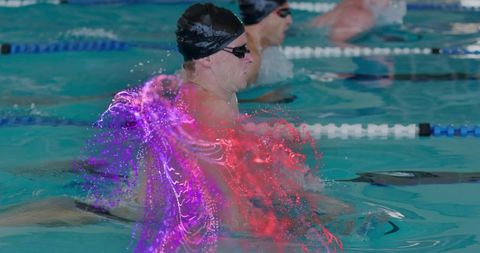 Competitive swimmer with particle effects in indoor pool
