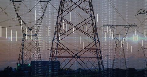 High-voltage transmission lines at dusk with digital data overlay