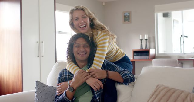Happy Young Multiracial Couple Relaxing at Home Together - Download Free Stock Images Pikwizard.com