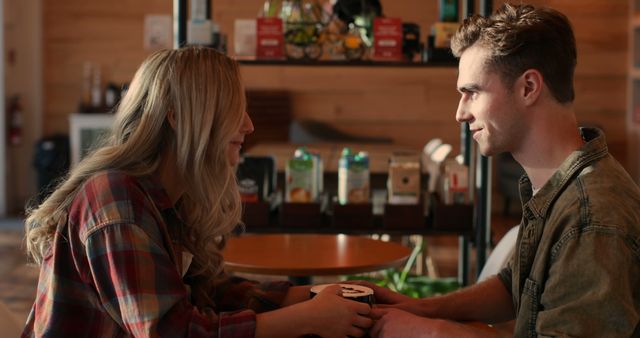 Young couple interacting with each other in cafe. Smiling happy couple 4k