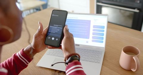 woman using smartphone ai chat app at home by laptop and coffee - Download Free Stock Images Pikwizard.com