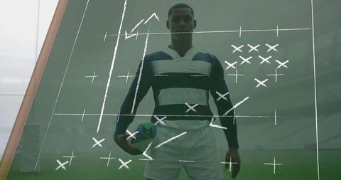 Rugby player analyzing strategy with game plan overlay