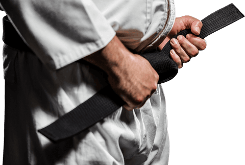 Karate black belt being tightened with focus and precision