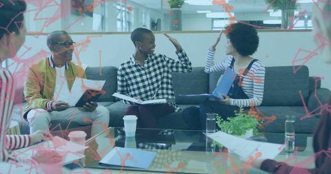 Diverse Business Team Analyzing Global Finance Data in Modern Office