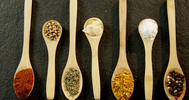 Wooden Spoons with Various Spices on Black Background - Download Free Stock Images Pikwizard.com