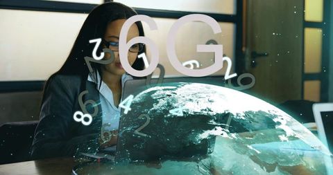 Businesswoman activating 6g network visualization over laptop with holographic globe