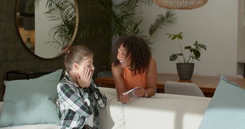 Surprised women reacting to pregnancy news