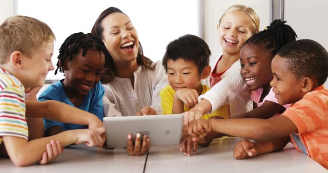 Diverse Classroom of Young Children Engaged with Teacher on Tablet - Download Free Stock Images Pikwizard.com