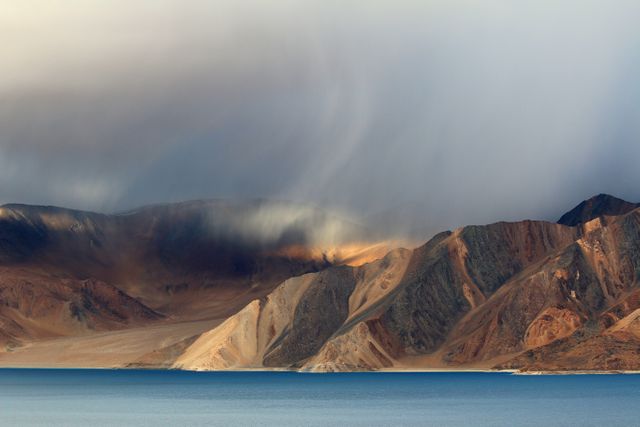 Dramatic Sky Over Mountain Range with Blue Lake - Download Free Stock Photos Pikwizard.com