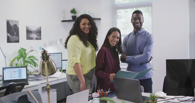 Team of Colleagues Smiling and Posing in Bright Office - Download Free Stock Images Pikwizard.com