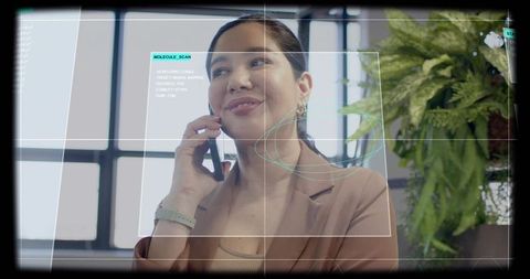 Latina businesswoman talking on smartphone with ar molecule scan hud in modern office