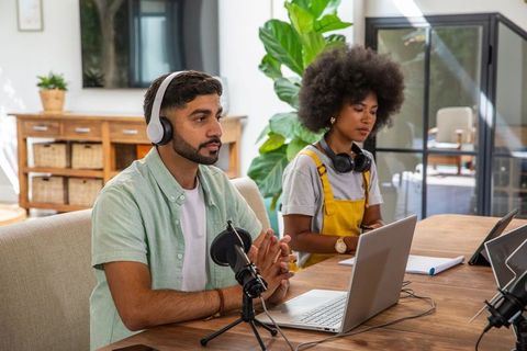 Diverse Team Collaborating on Podcast Production in Home Studio