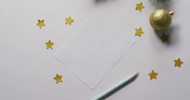 Image of christmas decorations and stars with white card on white background - Download Free Stock Photos Pikwizard.com