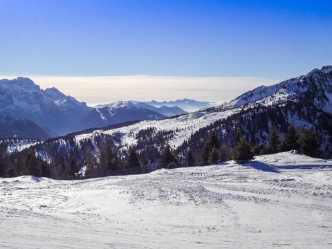 Scenic Snowy Mountain Range on Clear Winter Day