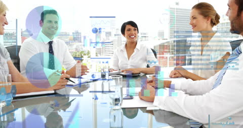 Business Team Meeting with Financial Data Graphics Overlay