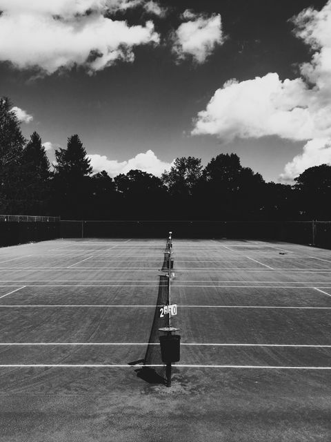 Empty Tennis Court on Cloudy Day in Black and White - Download Free Stock Photos Pikwizard.com