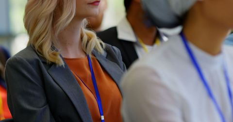 Businesswoman Attending Seminar with Focused Attention
