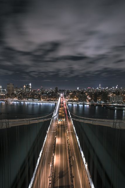 Night View of Suspension Bridge with City Skyline and Traffic - Download Free Stock Images Pikwizard.com