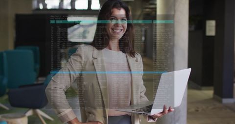 Businesswoman Analyzing Code on Laptop in Modern Office - Download Free Stock Images Pikwizard.com
