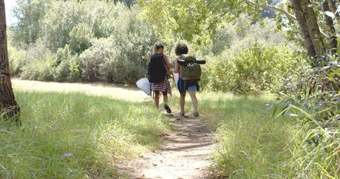Two Women Hiking on Forest Trail Collecting Trash - Download Free Stock Images Pikwizard.com