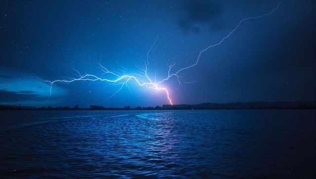 Dramatic Night Lightning Over Calm Lake Waters